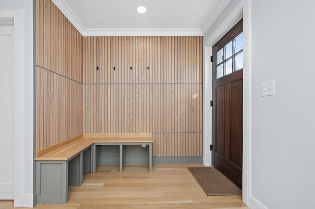 mudroom featuring light wood-type flooring and ornamental molding