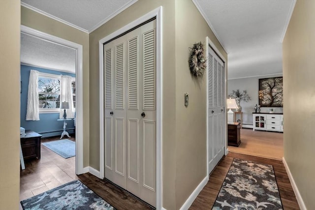 hallway with ornamental molding, dark hardwood / wood-style flooring, and a baseboard heating unit