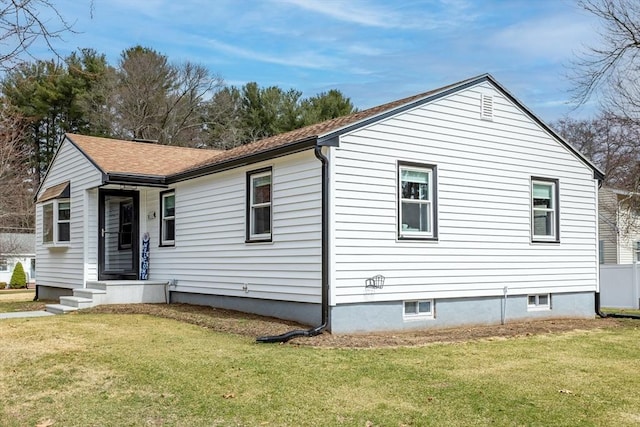 view of home's exterior featuring a lawn