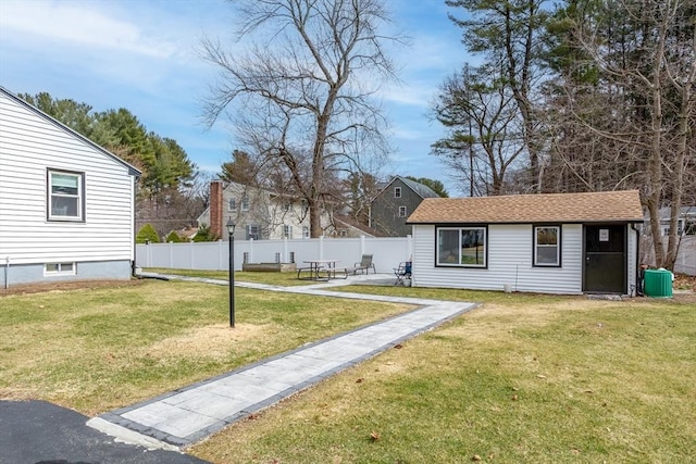 view of yard with an outdoor structure and a patio area