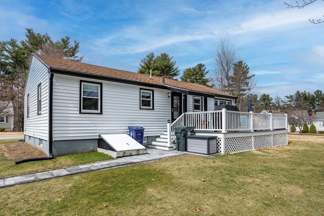view of front facade with a front lawn and a deck