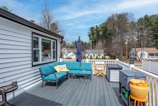 wooden deck featuring outdoor lounge area