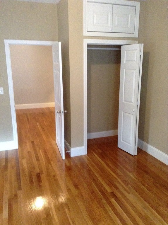 unfurnished bedroom with light wood-type flooring