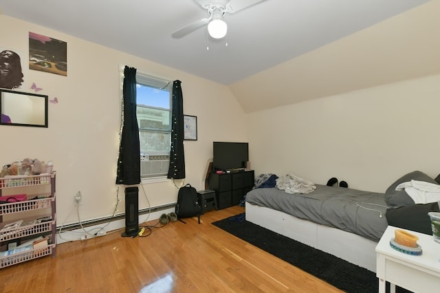 bedroom with ceiling fan, hardwood / wood-style floors, and lofted ceiling