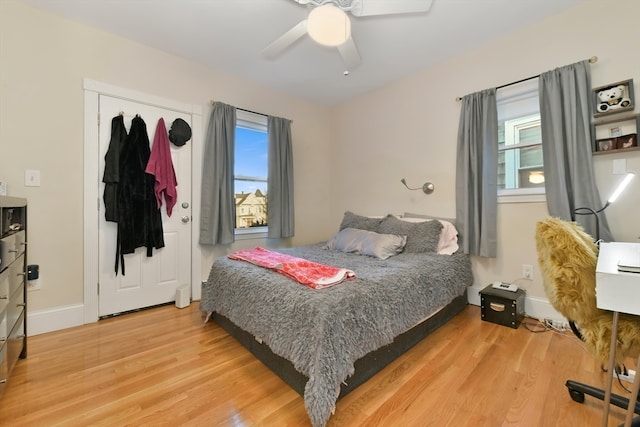 bedroom featuring hardwood / wood-style flooring and ceiling fan