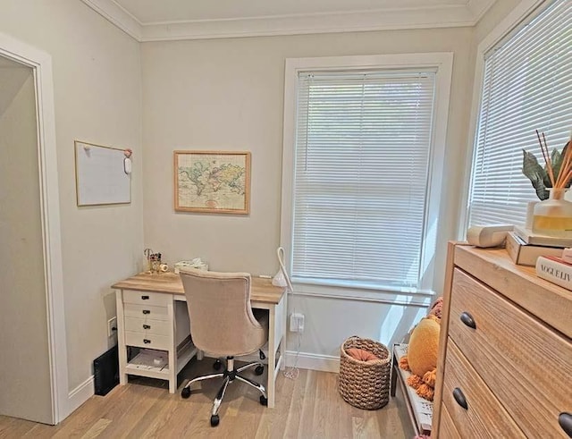 office area featuring ornamental molding, light wood-type flooring, and baseboards