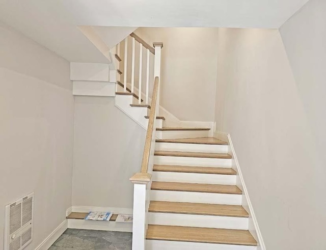 stairs featuring visible vents and baseboards