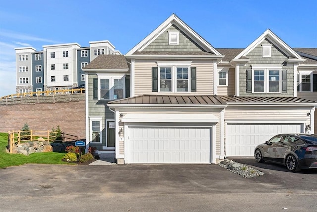 townhome / multi-family property featuring a garage