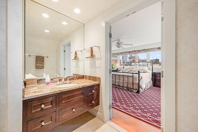 bathroom with connected bathroom, ceiling fan, vanity, tile patterned floors, and recessed lighting