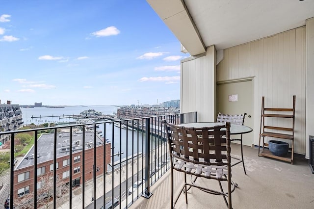 balcony with a view of city and a water view