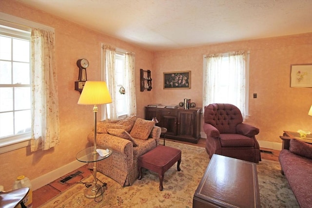 living room featuring visible vents and baseboards