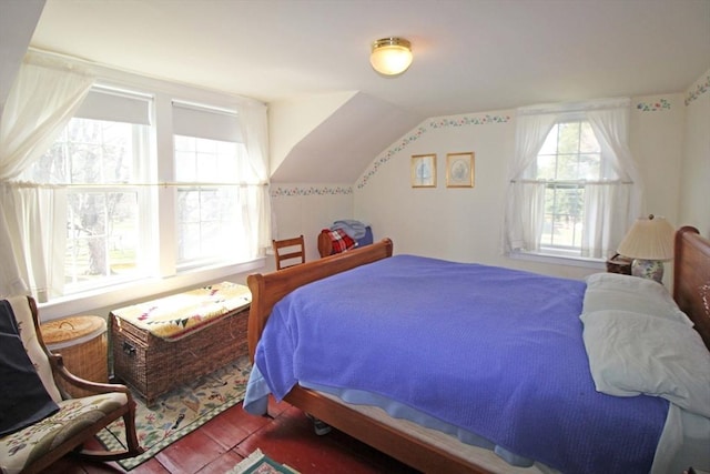bedroom with lofted ceiling