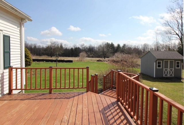 wooden terrace with a shed, an outbuilding, and a yard