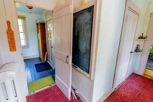 hall with wood finished floors