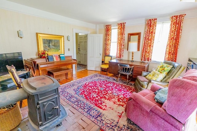 sitting room featuring a wood stove