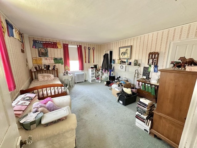 carpeted bedroom featuring wallpapered walls and radiator heating unit