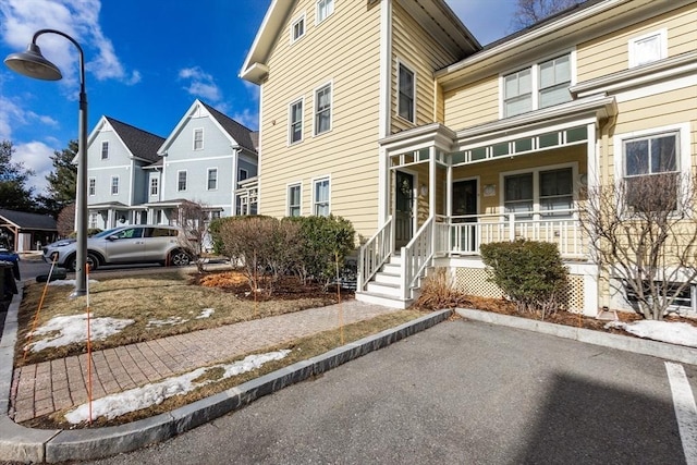 view of front of house featuring a porch and a residential view