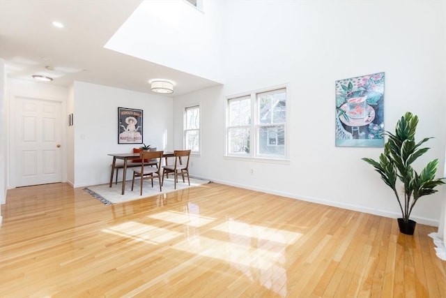 dining room featuring wood finished floors and baseboards