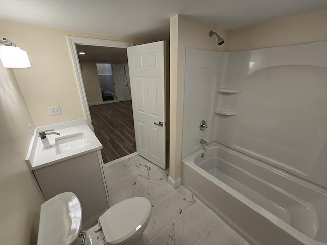 full bathroom featuring shower / bathtub combination, toilet, marble finish floor, vanity, and baseboards