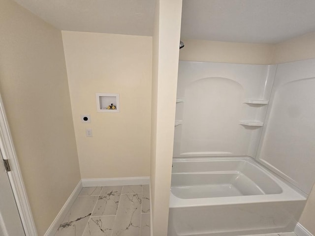 full bathroom with shower / washtub combination, baseboards, and marble finish floor
