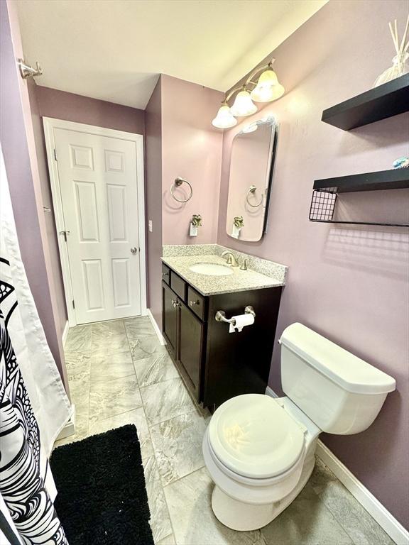 bathroom with vanity and toilet