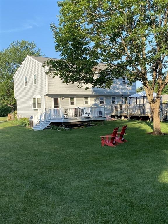 exterior space with a deck and a yard