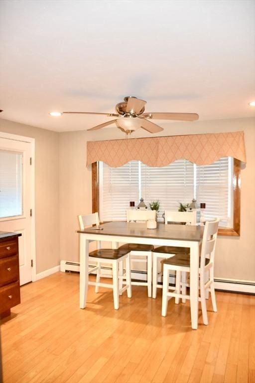 dining area featuring light hardwood / wood-style flooring and ceiling fan