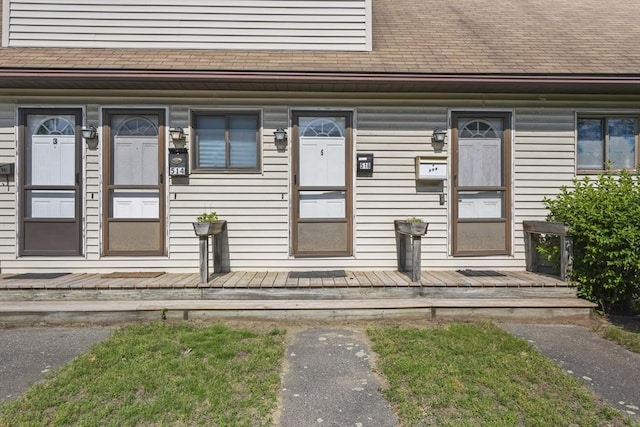 516 High St Unit 516, Clinton, MA 01510 - doorway to property featuring a shingled roof and a porch