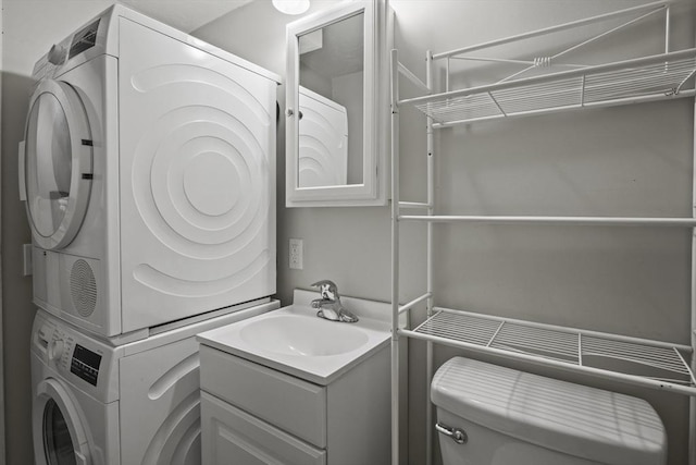 516 High St Unit 516, Clinton, MA 01510 - laundry area with stacked washing machine and dryer and a sink