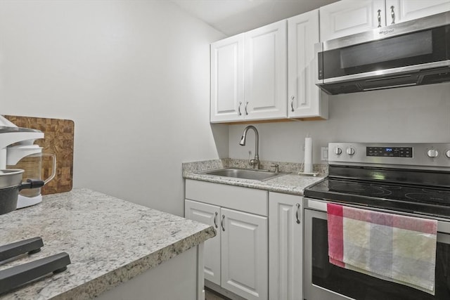 516 High St Unit 516, Clinton, MA 01510 - kitchen featuring appliances with stainless steel finishes, a sink, and white cabinetry