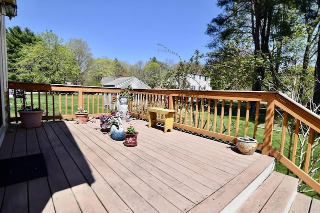 deck featuring a lawn