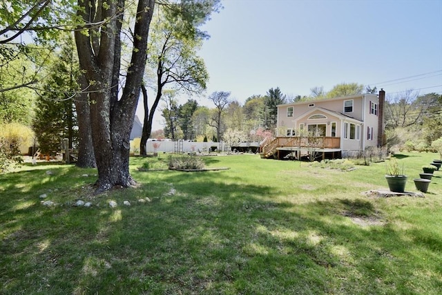 view of yard with a wooden deck