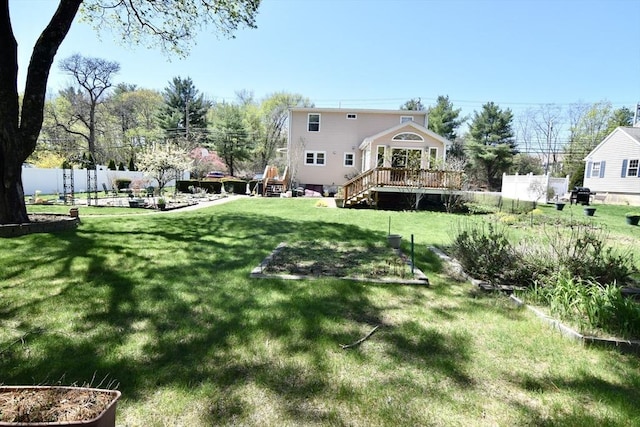 view of yard with stairway, fence, and a wooden deck