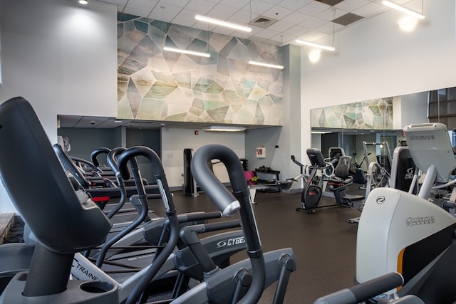 gym featuring a drop ceiling