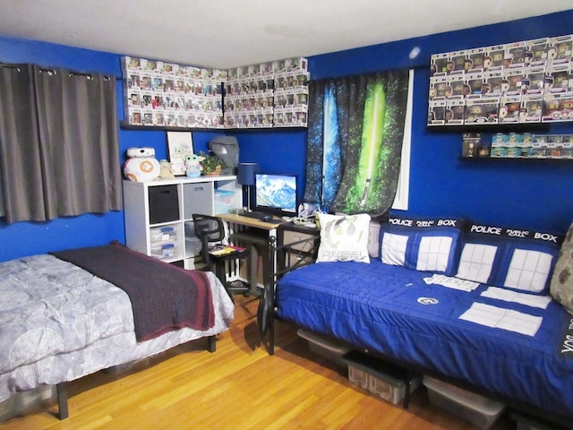 bedroom with hardwood / wood-style flooring