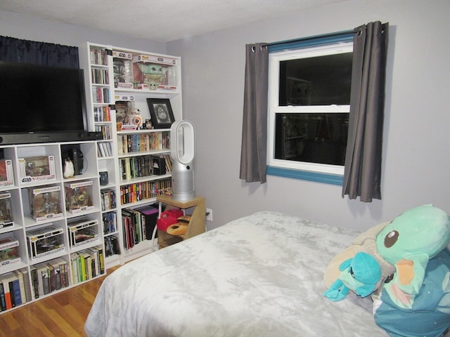 bedroom featuring hardwood / wood-style flooring