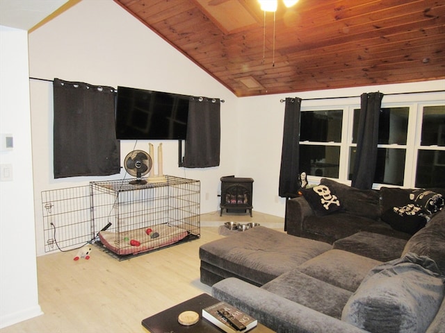 living room with a wood stove, wood ceiling, vaulted ceiling, and wood-type flooring