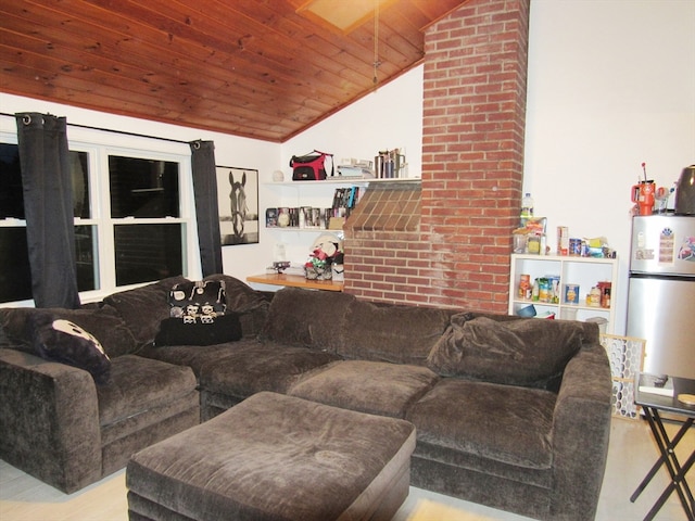 living room featuring vaulted ceiling with skylight, wood ceiling, and brick wall