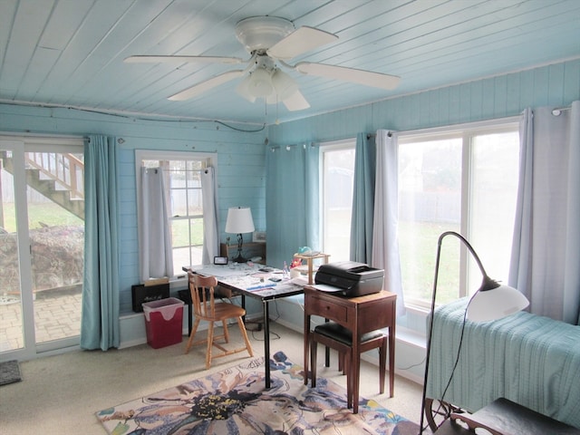 home office featuring wood ceiling, ceiling fan, light colored carpet, and a healthy amount of sunlight