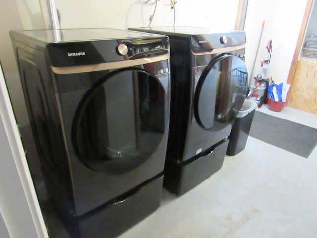 laundry area featuring washing machine and dryer