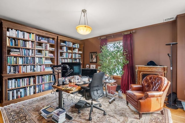 office with light hardwood / wood-style flooring