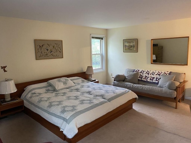 bedroom featuring carpet floors and baseboards