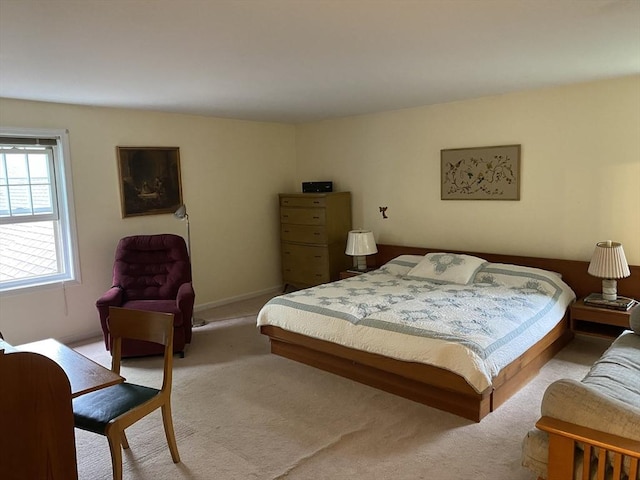 bedroom with light colored carpet
