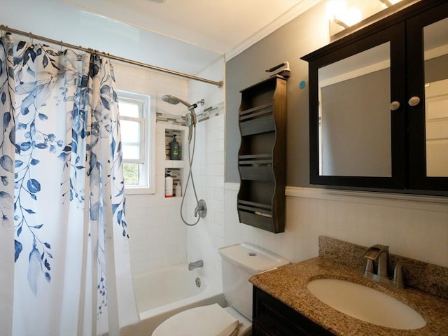 347 Lexington St, Woburn, MA 01801 - bathroom featuring shower / tub combo, vanity, toilet, and a wainscoted wall