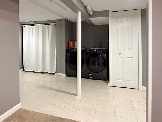 347 Lexington St, Woburn, MA 01801 - laundry room with baseboards and light tile patterned floors