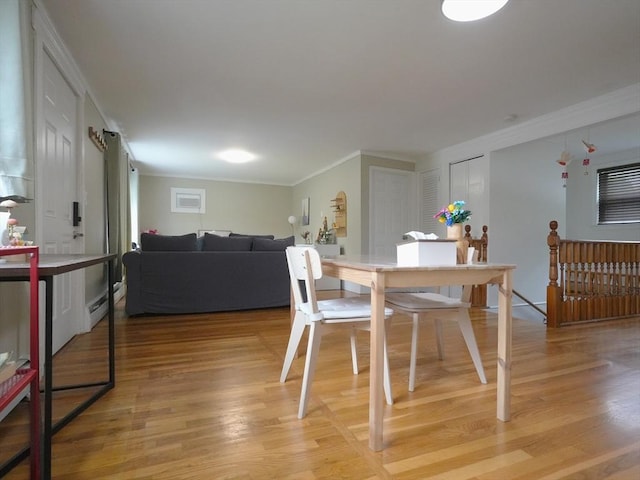 347 Lexington St, Woburn, MA 01801 - dining space with crown molding, light wood-type flooring, and baseboard heating