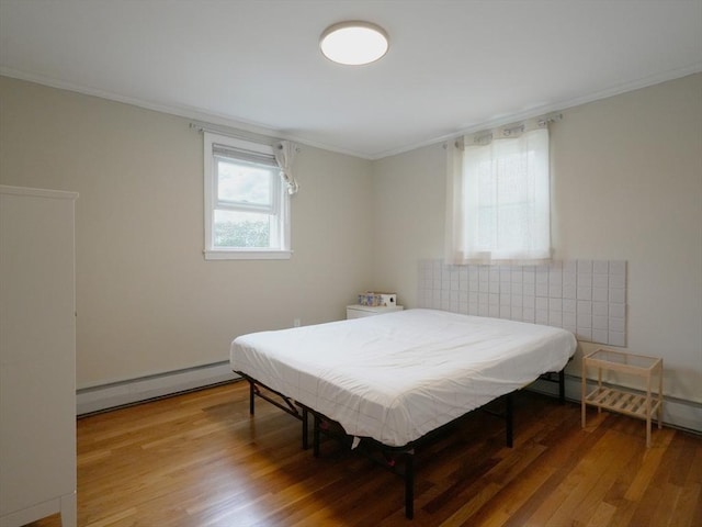 347 Lexington St, Woburn, MA 01801 - bedroom with a baseboard radiator, ornamental molding, and light wood-type flooring
