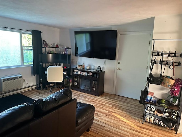26 Burnap Rd Unit 6, Holliston, MA 01746 - living area with wood finished floors and a wall mounted air conditioner