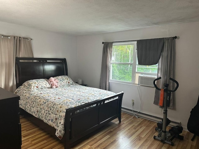 26 Burnap Rd Unit 6, Holliston, MA 01746 - bedroom featuring wood finished floors and a textured ceiling