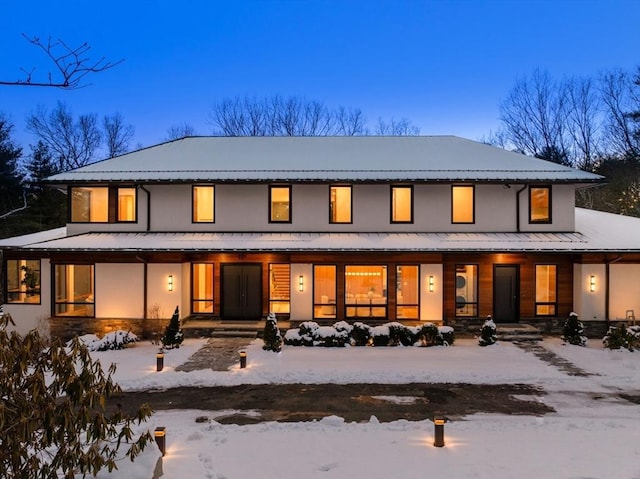 view of snow covered house